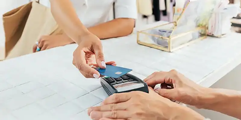 a credit card on a payment processing terminal